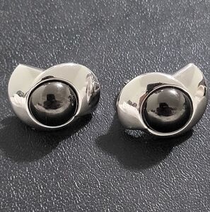 Monet silver-tone clip on earrings with a black pearl like center stone